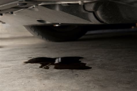 reddish brown fluid leaking from car|Identifying Car Fluid Leak Colors and What They。